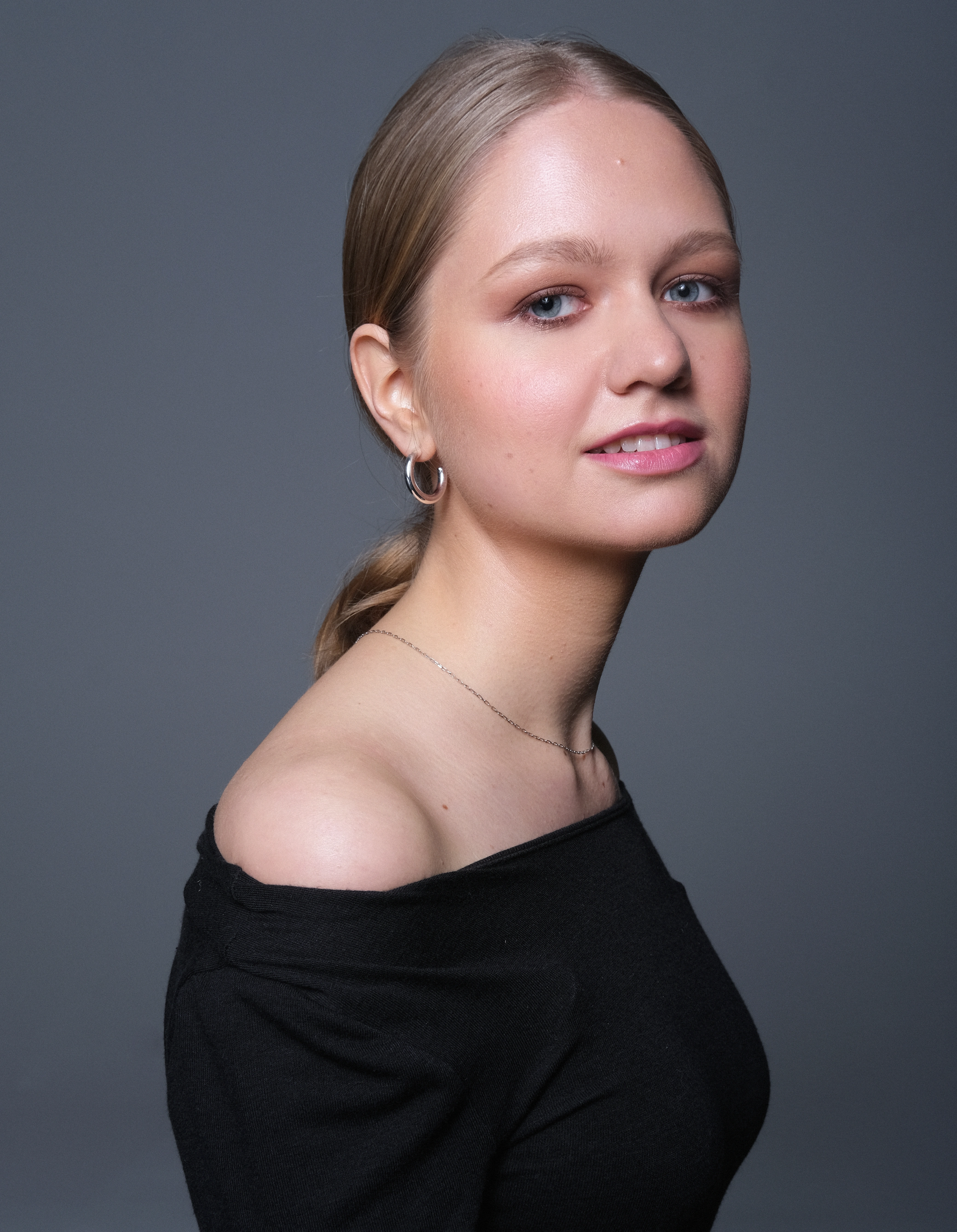 Wide shot of pianist performing on concert stage